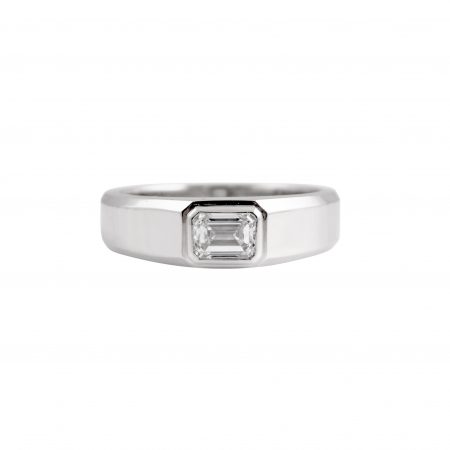 Emerald cut ring in platinum 950, featuring a 0.74ct rectangular Emerald cut diamond set into a bezel setting. CAR